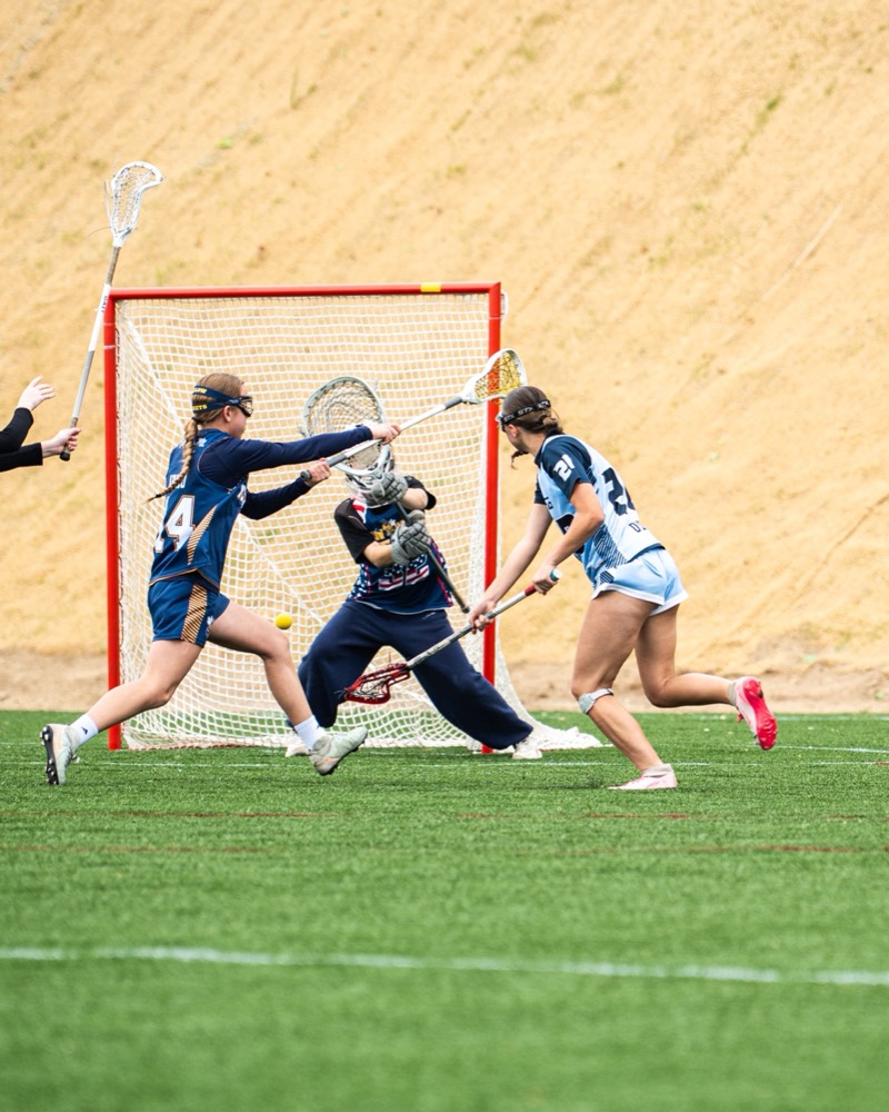An FLG goalie sliding across the crease to make a save.